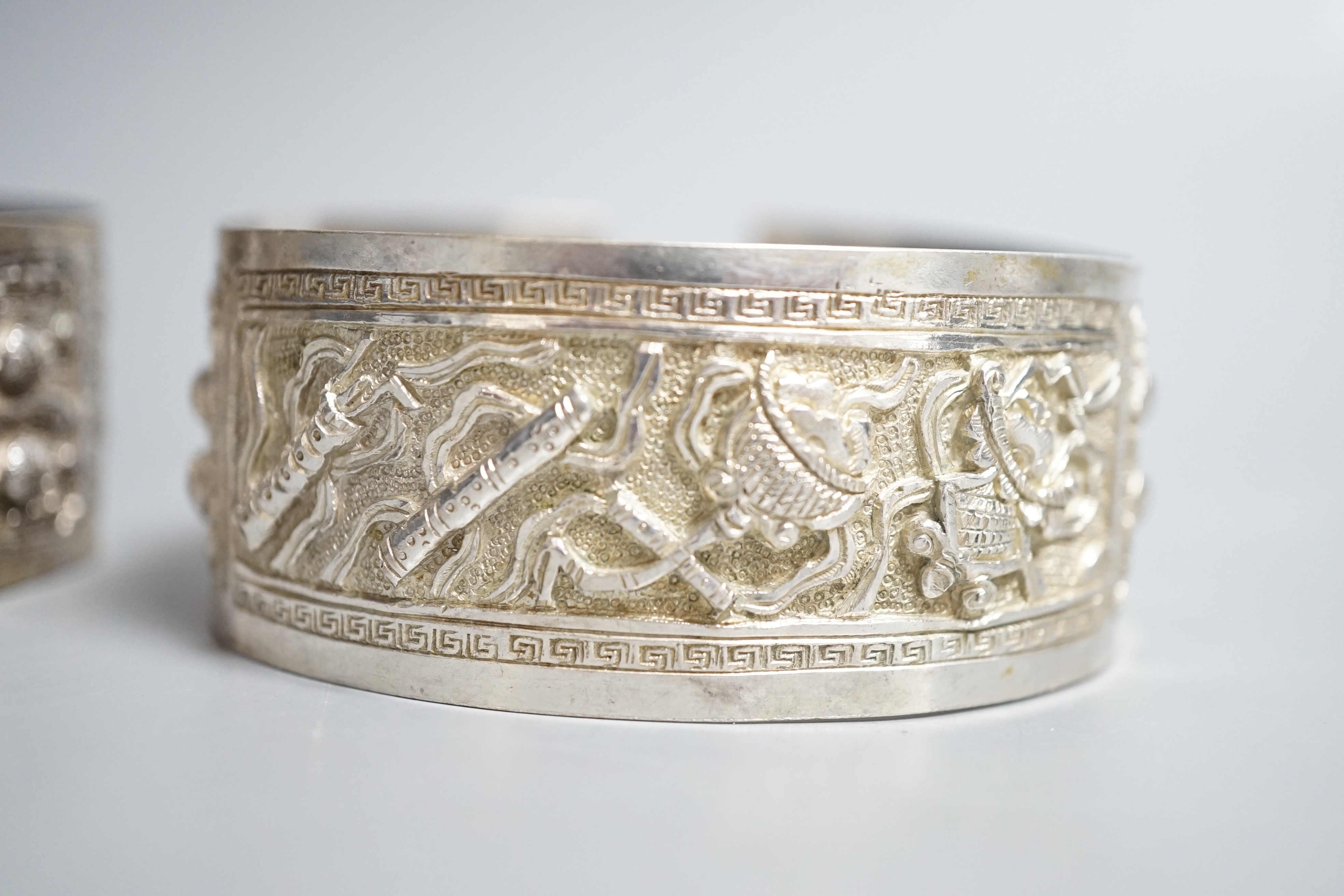 A pair of early 20th century Chinese white metal bangles